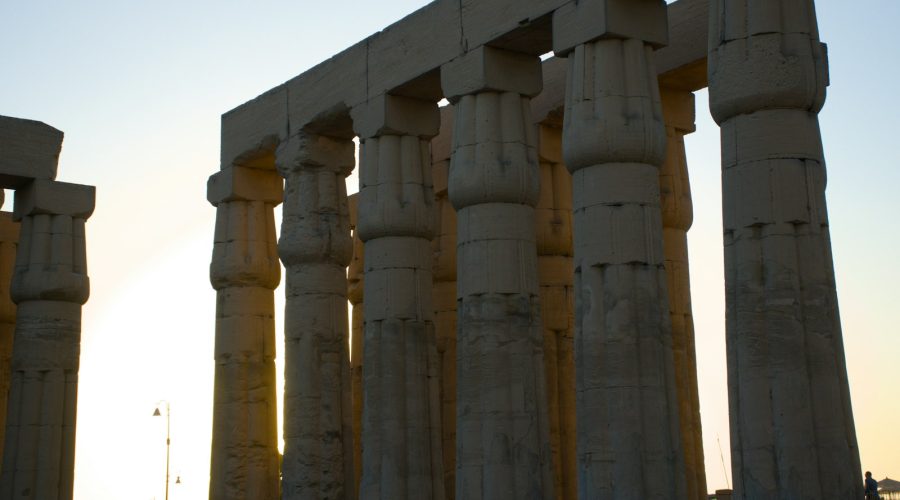 Columns of Luxor Temple at sunset, reached by private transfer from Luxor airport