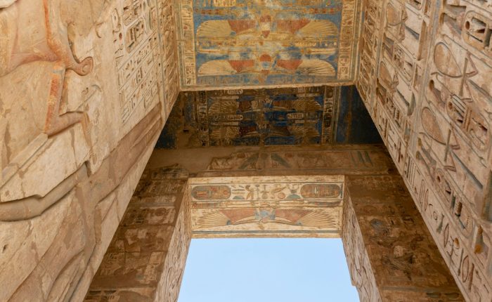Hieroglyph reliefs on a giant doorway at Medinet Habu on a Valley of the Queens tour in Luxor