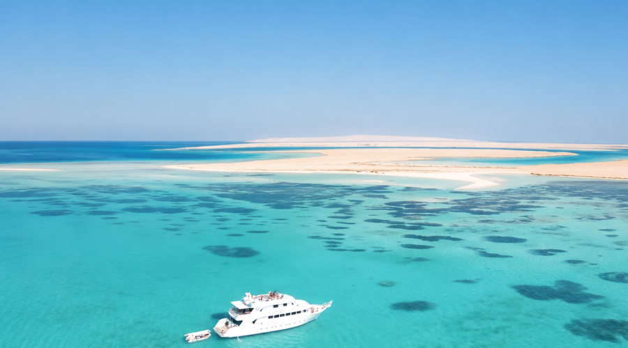 White Island Tour from Sharm El Sheikh with clear turquoise water and boats near Ras Mohammed