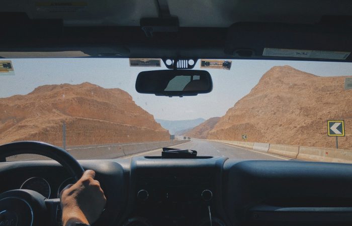 View from a private car on a desert road in Egypt during an airport transfer
